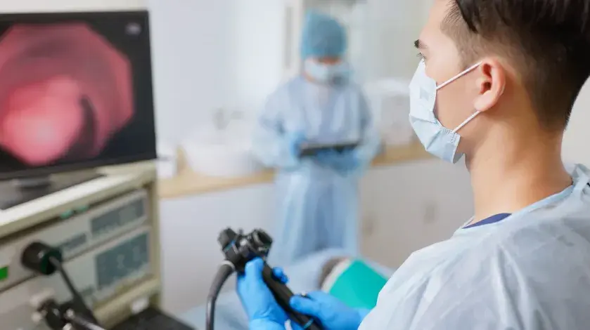 A provider watching a monitor during a colonoscopy