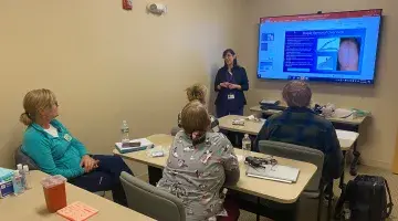 Elisa of South Shore VNA teaches a class in the new VNA sim lab