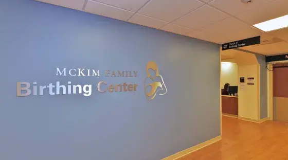 The wall sign of the McKim Family Birthing Center at South Shore Hospital